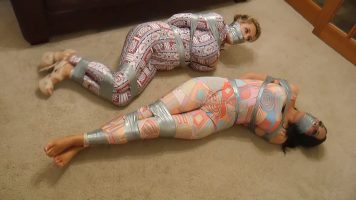 Sienna & Katie Thornton – One Punishing Tape Bondage Ordeal For Our Busty Wriggling GlitterBall Captives! (Borderland Bound)