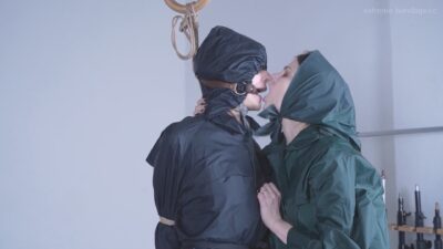 Ofelia & Lia – Raincoat Slave is Desparete for Mistress’s Kiss